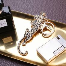 Cheetah Keychain, Gold-Toned Frame With Densely Studded Clear Sparkling Crystals, Black Crystal Leopard Print Accents, Small Green Crystal Eye Detail, 3D Dynamic Cheetah Shape, Ideal Key Accessory, Party Outfits, Gifts For Animal Lovers &  Styling - Vàng - Xem 4