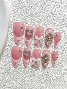 Bộ 10 miếng dán móng tay thanh lịch, màu nude và hồng, họa tiết hoa 3D với trái tim đính đá, nơ, cánh hoa và pha lê vàng, kèm dụng cụ làm móng (1 miếng dán dạng gel + 1 dũa móng), 3 kiểu móng: hạnh nhân, mỏ vịt, hình quan tài, thích hợp cho các dịp quan trọng, tiệc tùng, đám cưới, ngày lễ. - Nhiều màu - Xem 12