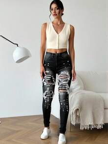 Vaqueros lavados con rotos de cintura alta para mujer, elásticos y ajustados - Negro - Ver 1