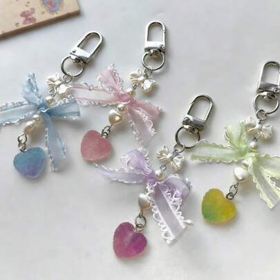 This Plaid Bow Heart-Shaped Soft Candy Pendant Charm Features A Sweet And Lively Design. It Can Be Used As A Phone Strap Or Keychain, Is Portable And Compact, And Can Be Used To Decorate Bags. Gently Rotating It With Your Fingers Can Relieve Stress And Bring A Sense Of Comfort, Making It An Ideal Fashionable And Practical Choice For Holiday Gifts.