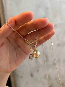 rundraw 1件新款创意设计登山扣仿珍珠吊坠不对称水晶流苏优雅时尚铜金色项链，适合女性佩戴，可用于派对、宴会、通勤、日常穿搭，是节日和周年纪念日送给朋友、爱人、家人的最佳礼物。 - 金色 - 查看 3