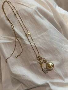 rundraw 1件新款创意设计登山扣仿珍珠吊坠不对称水晶流苏优雅时尚铜金色项链，适合女性佩戴，可用于派对、宴会、通勤、日常穿搭，是节日和周年纪念日送给朋友、爱人、家人的最佳礼物。 - 金色 - 查看 4