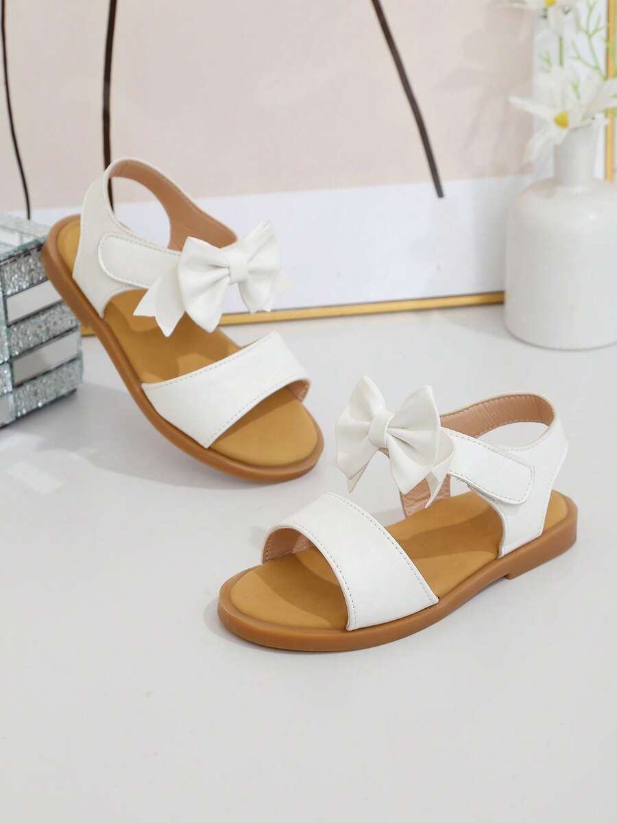 A Pair Of The Latest Summer Children's Pure White Bow-Knotted Simple Hook And Loop Sandals - Easy To Wear, Suitable For Daily Outings, Park Walks, Shopping In The Mall, And Can Be Effortlessly Paired With Various Children's Outfits,Girls Sandals - White - View 1