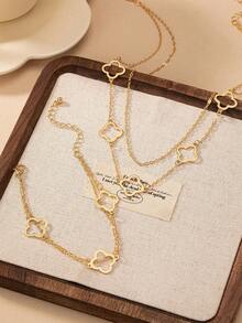 2件套时尚简约镂空四叶草金属吊坠项链手链套装，适合少女日常、派对、节日穿着
