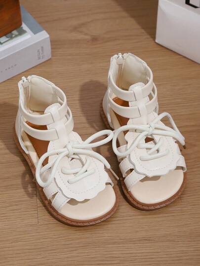 1双女童夏季凉鞋，百搭米色，蝴蝶结系带装饰，后拉链，镂空鞋面，适合休闲穿着和搭配各种服饰