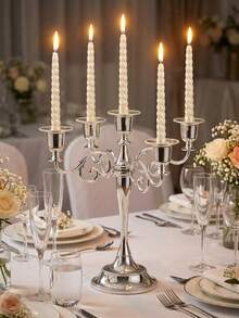 一套五臂螺旋纹烛台。金属材质，造型完整。整体设计体现欧式轻奢美学；底座和烛杯边缘饰有精致的雕刻图案，烛臂则采用卷曲的螺旋纹样。 - 彩色 - 查看 8