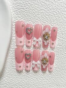 Bộ 10 miếng dán móng tay thanh lịch, màu nude và hồng, họa tiết hoa 3D với trái tim đính đá, nơ, cánh hoa và pha lê vàng, kèm dụng cụ làm móng (1 miếng dán dạng gel + 1 dũa móng), 3 kiểu móng: hạnh nhân, mỏ vịt, hình quan tài, thích hợp cho các dịp quan trọng, tiệc tùng, đám cưới, ngày lễ. - Nhiều màu - Xem 15