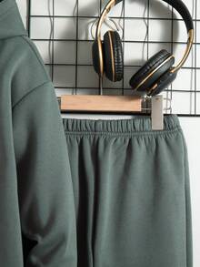 Bộ 2 món cho bé trai tuổi teen, gồm áo hoodie và quần dài in chữ, kiểu dáng thường ngày, có lớp lót giữ nhiệt, thích hợp cho mùa thu/đông. - Màu xám đen - Xem 8