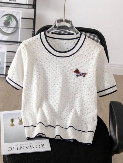 New Round Neck Short Sleeve Knit Sweater, Overall In White Color, Black Trim At Collar And Cuffs, Hollow Knit Texture On Body, Colorful Puppy Graphic On Chest, Simple Lines And Bright Colors, Fresh And Casual Style, Breathable And Fashionable, Suitable For Spring And Summer