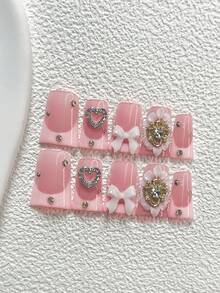 Bộ 10 miếng dán móng tay thanh lịch, màu nude và hồng, họa tiết hoa 3D với trái tim đính đá, nơ, cánh hoa và pha lê vàng, kèm dụng cụ làm móng (1 miếng dán dạng gel + 1 dũa móng), 3 kiểu móng: hạnh nhân, mỏ vịt, hình quan tài, thích hợp cho các dịp quan trọng, tiệc tùng, đám cưới, ngày lễ. - Nhiều màu - Xem 17