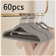 1/5/10/20/60/100个装防滑隐形衣物保护套，超薄节省空间设计，适用于衬衫、裤子、连衣裙等各种衣物，是居家衣橱、零售展示衣架的必备之选。纤薄设计，简约收纳架，坚固耐用的塑料衣架，多功能衣架，家居收纳，时尚精品店适用。