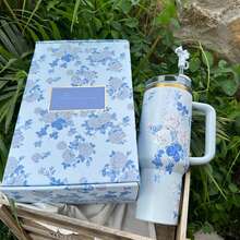 Stanley2025 40 Oz H2.0 Insulated Tumbler,With A Comfortable Handle, Featuring Double-Walled Vacuum Insulated Stainless Steel Construction. This High-Quality Drinkware Keeps Your Beverages At The Perfect Temperature, Whether It's Hot Or Cold, Ensuring The Original Taste Is Preserved For Longer Periods. Designed To Be Lightweight And Portable, It's Perfect For Outdoor Activities Like Camping, Hiking, Driving, And Travel. With A Large Capacity, It Meets Your Hydration Needs Throughout The Day. Stylish And Convenient To Carry, It's An Ideal Choice For Outdoor Enthusiasts And Makes A Thoughtful And Practical Gift, Whether For Friends Or Family. - Blue Flowers + Gift Box - View 4