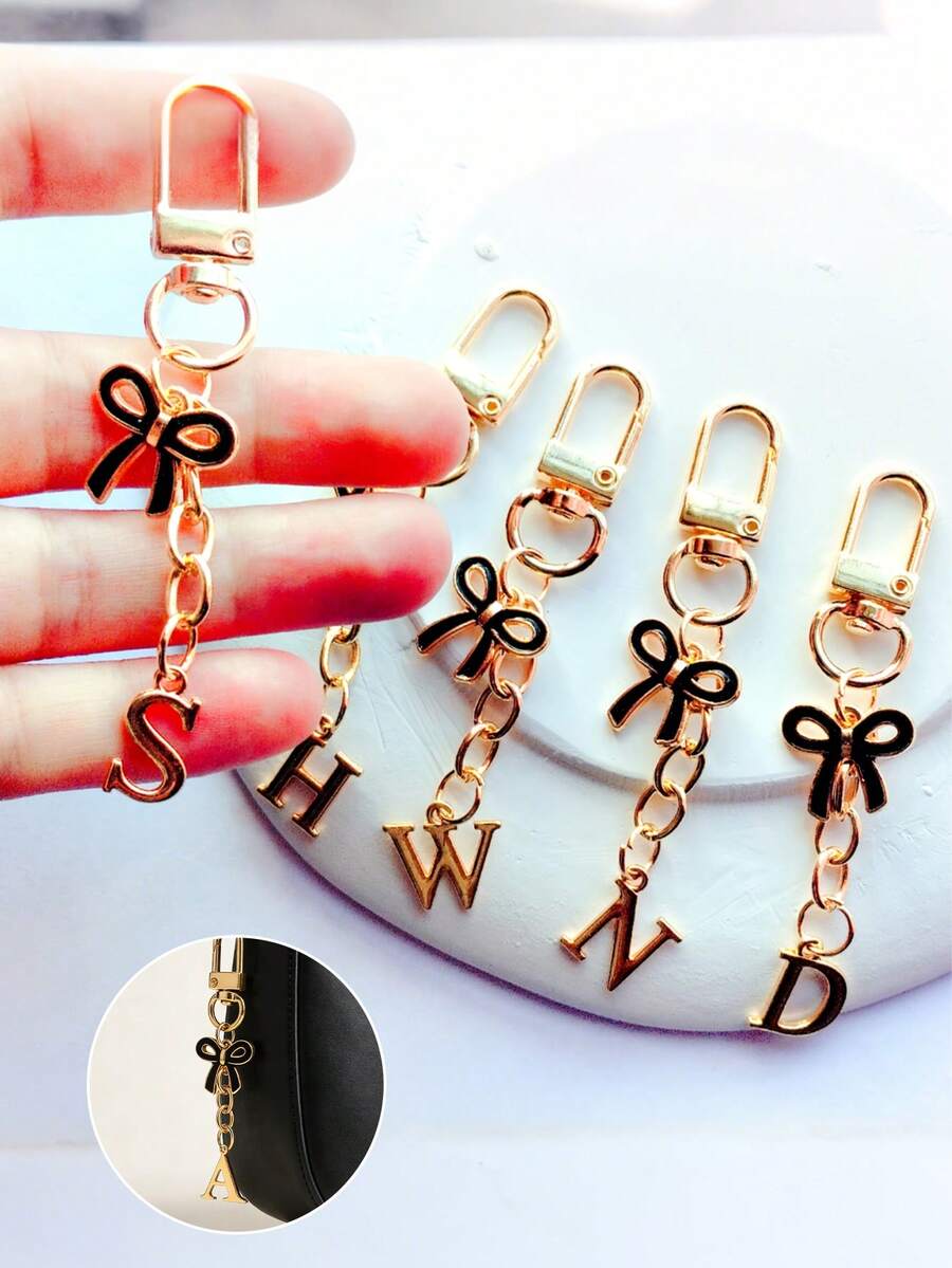 Black Bow Tie Letter Keychain Pendant, Letter Bow Tie Keychain, A-Z Letter Bag Charm, Personalized Letter Keychain, Suitable For Bags, Backpacks, Wallets, Earphone Cases, Car Keys, Graduation Season, Back To School Season, Wedding Season, Holiday Gifts, Birthday Gifts, Valentine's Day Gifts, Mother's Day Gifts And Other Small Gifts