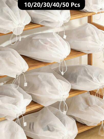 10/15 piezas Bolsas de zapatos portátiles semi-transparentes, bolsas de zapatos de tela no tejida transpirable, bolsas a prueba de polvo de mano, bolsas con cordón ligeras para guardar zapatos y bolsos, aislar el polvo, mantener los zapatos y bolsos limpios y ordenados, empaque conveniente, impermeable, portátil, diseño colgante, adecuado para cruceros, viajes y vacaciones.