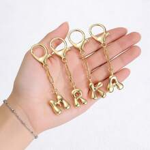 Un colgante de llavero con forma de globo de aire, con forma de burbuja a la moda, equipado con ganchos de equipaje etiquetados con las 26 letras del alfabeto inglés de la A a la Z. - Multicolor - Ver 4