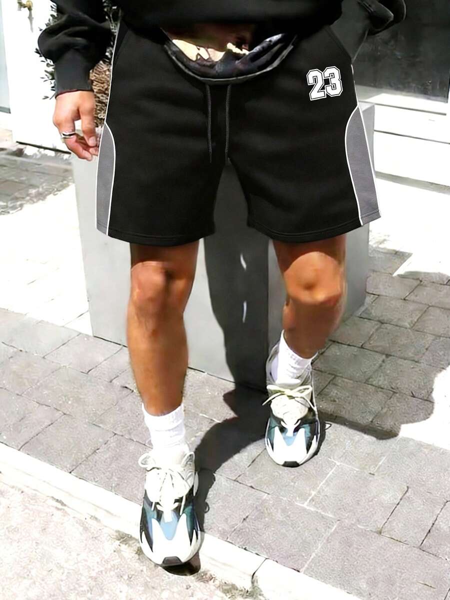 男士黑色运动短裤，饰有23号图案印花、撞色拼接、弹性腰带，街头风格 - 黑色 - 查看 1