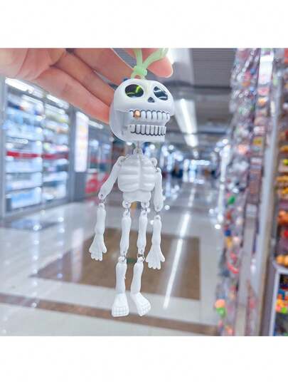 1件节日礼物趣味拉绳骷髅潮流跨境钥匙扣恶搞拉绳骷髅骨头包挂件（颜色随机）
