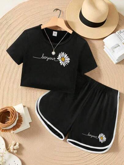 Conjunto informal de camiseta de manga corta con cuello redondo y estampado de letras y margaritas, y pantalones cortos para niña preadolescente