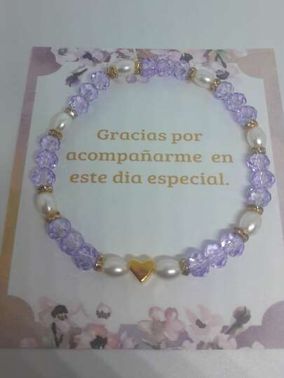 Sets de 10/12/15 piezas.  Pulsera de Recuerdo para Eventos – Perlas y Cristal Lila con Corazón Dorado  Hermosa pulsera diseñada como recuerdo y detalle de agradecimiento para todo tipo de celebraciones especiales. Su diseño combina cristales facetados color lila, perlas blancas y un elegante dije de corazón dorado, creando una pieza delicada, femenina y elegante.  Incluye tarjeta decorativa con mensaje de agradecimiento, lista para entregar, lo que la hace perfecta como recuerdo o regalo para invitados en bautizo, primera comunión, boda, fiestas, reuniones y celebraciones especiales.  Es una excelente opción para quienes buscan un detalle bonito, económico y significativo para agradecer la asistencia de sus invitados.  ✨ Ideal como: Recuerdo, detalle de agradecimiento, obsequio para invitados, regalo decorativo.   Incluye: 1 pulsera con tarjeta decorativa (Disponible en sets según tu selección)   Lista para regalar