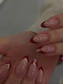 10片手工杏仁形假指甲，红色法式甲尖，古铜金色镶边，饰以金色星星。特点：手工绘制的红色法式甲尖，搭配古铜金色镶边，饰以手工制作的3D金色金属装饰。 - 彩色 - 查看 2