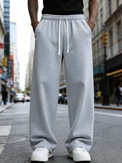 男士宽松休闲运动裤，简约纯色阔腿设计，抽绳腰带，大口袋，适合日常步行、工作、旅行等场合。“由于生产批次不同，可能存在一些色差。”