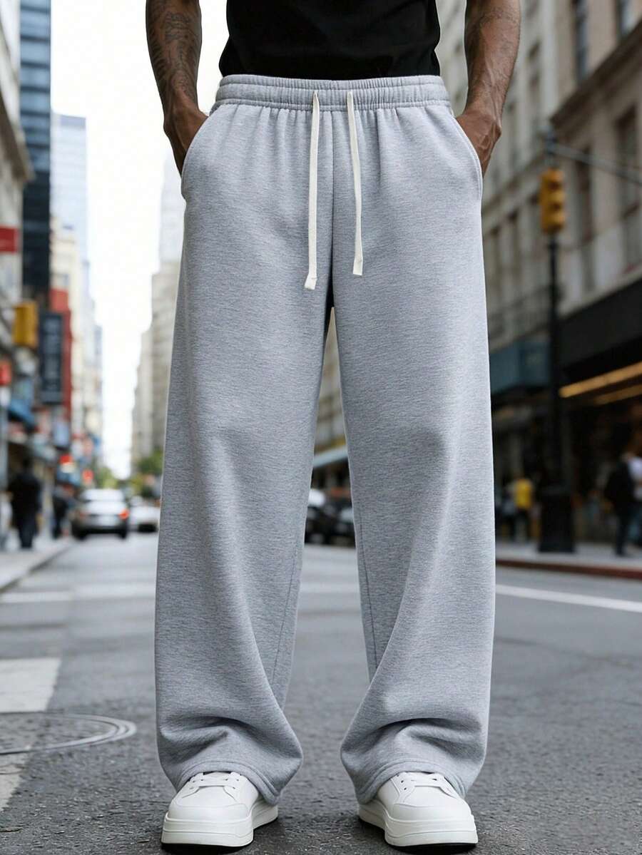 1 szt. Luźne, sportowe spodnie męskie, minimalistyczny, jednolity kolor, szerokie nogawki, ściągacz w pasie, duże kieszenie, odpowiednie do codziennego chodzenia, pracy, podróży itp. "Ze względu na różnice w partiach produkcyjnych mogą występować pewne różnice w kolorach".