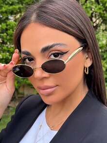 一副小椭圆形金属框时尚眼镜，高端复古个性百搭男女通用时尚眼镜，适合日常佩戴、街头摄影、度假、海滩等场合。