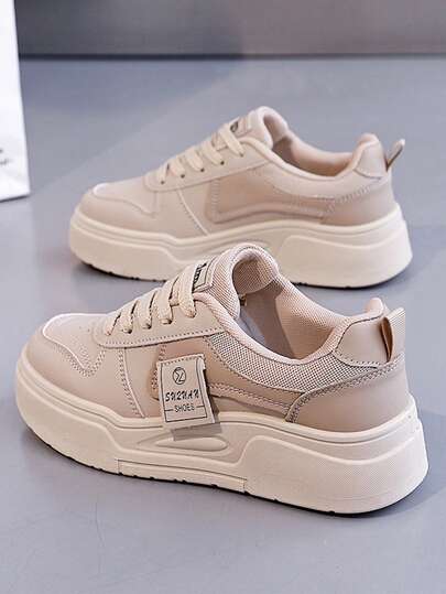 女士低帮运动鞋，轻便缓震设计，系带款式，四季皆宜的城市户外休闲鞋，透气鞋面，适合健身、跑步、日常穿着，简约风格，舒适透气。