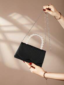 REMANLAND 一款优雅迷人的珍珠手拿包，精致奢华，翻盖设计，适合作为鸡尾酒会/派对包、女士晚宴包、单肩/斜挎包，配有金属链条肩带，是女士出席派对、婚礼、盛会、宴会的理想之选，也是派对女孩和女士的完美之选，同时也是送给女性的绝佳礼物。 - 黑色 - 查看 3