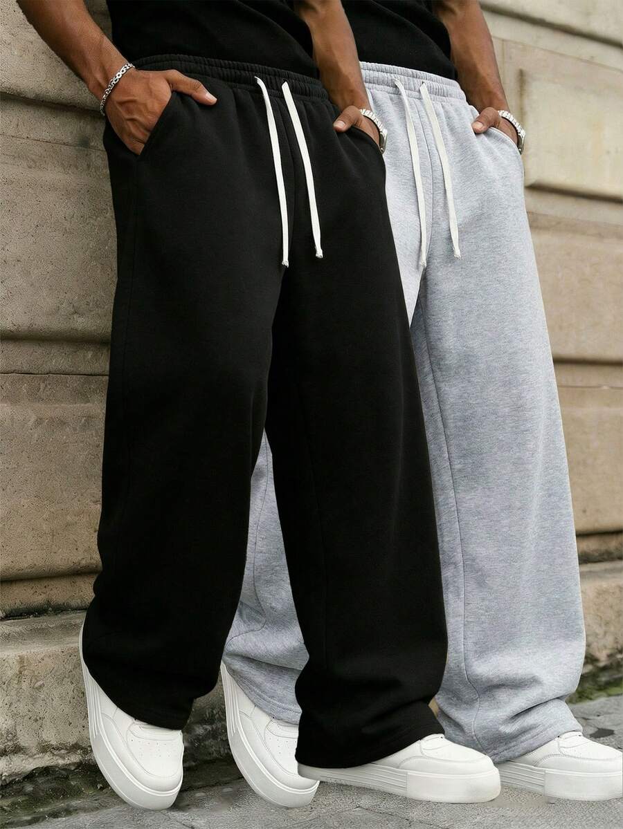 男士宽松休闲运动裤，纯色阔腿设计，抽绳腰带，大口袋，适合日常步行、工作、旅行等各种场合。采用涤纶面料，轻盈舒适，版型宽松。 - 黑色 - 查看 1