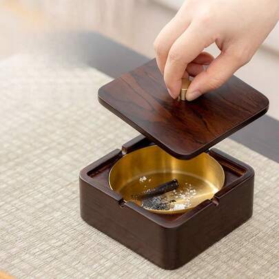 Walnut & Brass Ashtray With Wooden Lid - Odor-Proof Ashtray. Fashionable & Durable: Effectively Prevents Ash And Odor Dispersion, Suitable For Home/Office. Easy To Clean Metal Inner Liner With Smooth Wooden Lid. Portable & Practical: Suitable For Daily Use And Also As A Modern Decorative Piece!