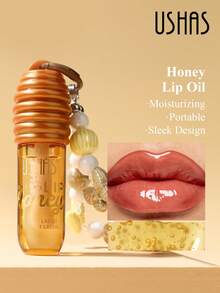 USHAS Honey Nourishing Moisturizing Lip Oil, Creative Pendant Design For Hanging On Bags Or Phones, Deep Moisturization And Hydration, Non-Sticky Formula, Day And Night Nourishing Care, Fashionable Makeup Accessory For Holidays, Creates Plump, Dewy Lips