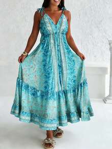 Chiếc đầm maxi phong cách Bohemian cỡ lớn này có cổ chữ V sâu quyến rũ và dây đeo vai mảnh mai. Họa tiết hoa màu xanh dương tuyệt đẹp trải dài xuống eo, tôn lên vóc dáng thanh lịch và quyến rũ. - Màu xanh lam - Xem 2