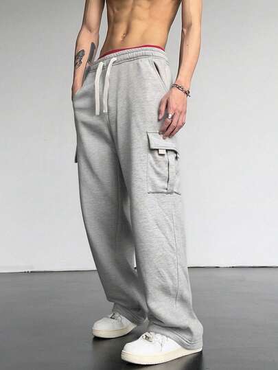 男士户外休闲工装慢跑裤 - 宽松版型运动裤，配有大口袋、弹性抽绳腰带和舒适内衬，适合户外活动、日常穿着和休闲活动。