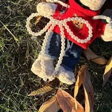 新款时尚简约珍珠蝴蝶结吊坠，适用于手机壳、钥匙扣及其他配件。小众设计，时尚珍珠蝴蝶结吊坠，适用于手机和钥匙扣。