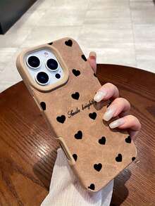 1个时尚简约柔软心形文字印花棕色手机壳，时尚高端防滑磨砂质感，适用于17/16/15/14/13/12/11/Promax/Pro/Plus系列及其他型号，是送给同事、朋友、家人、情侣的理想礼物，也适合生日、新年、情人节、斋月、复活节等场合。