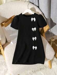 适合少女的独特 A 字型黑色连衣裙，带有优雅的 3D 蝴蝶结细节、泡泡袖和前下摆 - 涤纶，膝盖长度，青少年派对连衣裙，春夏