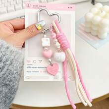 Questo portachiavi a forma di cuore è realizzato in corda intrecciata resistente con un design personalizzato. È un accessorio multifunzionale che può essere appeso a borse e bagagli per aggiungere un tocco di moda e può anche essere un ottimo piccolo regalo per uso quotidiano. - Multicolore - Visualizzare 3
