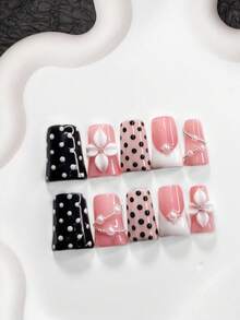 Bộ 10 móng giả chấm bi, móng dán acrylic, họa tiết chấm bi đen trắng cổ điển, hoa trắng 4 cánh vẽ tay, trang trí bằng hạt bạc, sơn móng tay màu hồng và đen, phong cách dễ thương và tinh nghịch, bao gồm dụng cụ làm móng (1 miếng dán gel + 1 dũa móng), 3 kích cỡ để lựa chọn. - Nhiều màu - Xem 15