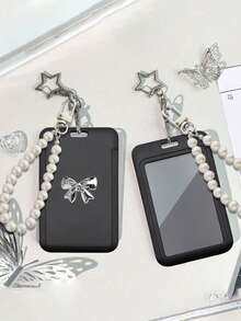 黑色卡包，饰有星星、仿珍珠吊坠和蝴蝶结，可作包包挂饰或钥匙扣。可收纳身份证、名片、交通卡、照片、居留证、门禁卡等。女士钱包、迷你钱包、手拿包、小钱包、腕包、卡包。 - 彩色 - 查看 5