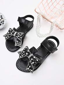 Sandalias de princesa para niñas, nuevas para el verano 2025, con lazo negro, con strass y perlas, de punta abierta, con cierre de gancho y bucle, y suela blanda - Negro - Ver 2