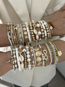 17KM 14/7/5件套简约时尚波西米亚风手链套装，包含心形、海星、仿贝壳、蝴蝶、雏菊、8字形水晶、仿珍珠等元素，适合女性、情侣、姐妹、度假、约会、日常佩戴、派对、情人节等场合。 - 彩色 - 查看 2