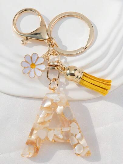 Móc khóa chữ cái đầu tiếng Anh bằng nhựa mạ vàng hình vỏ sò, trang trí tua rua hoa cúc nhỏ giọt dầu, thích hợp làm dây đeo túi xách, dây treo điện thoại, móc chìa khóa và quà tặng cho bạn bè và mẹ.