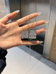 一本带书页的圣经，内含主祷文，附赠十字架吊坠、护身符项链、圣经十字架和幸运符。 - A - 查看 4