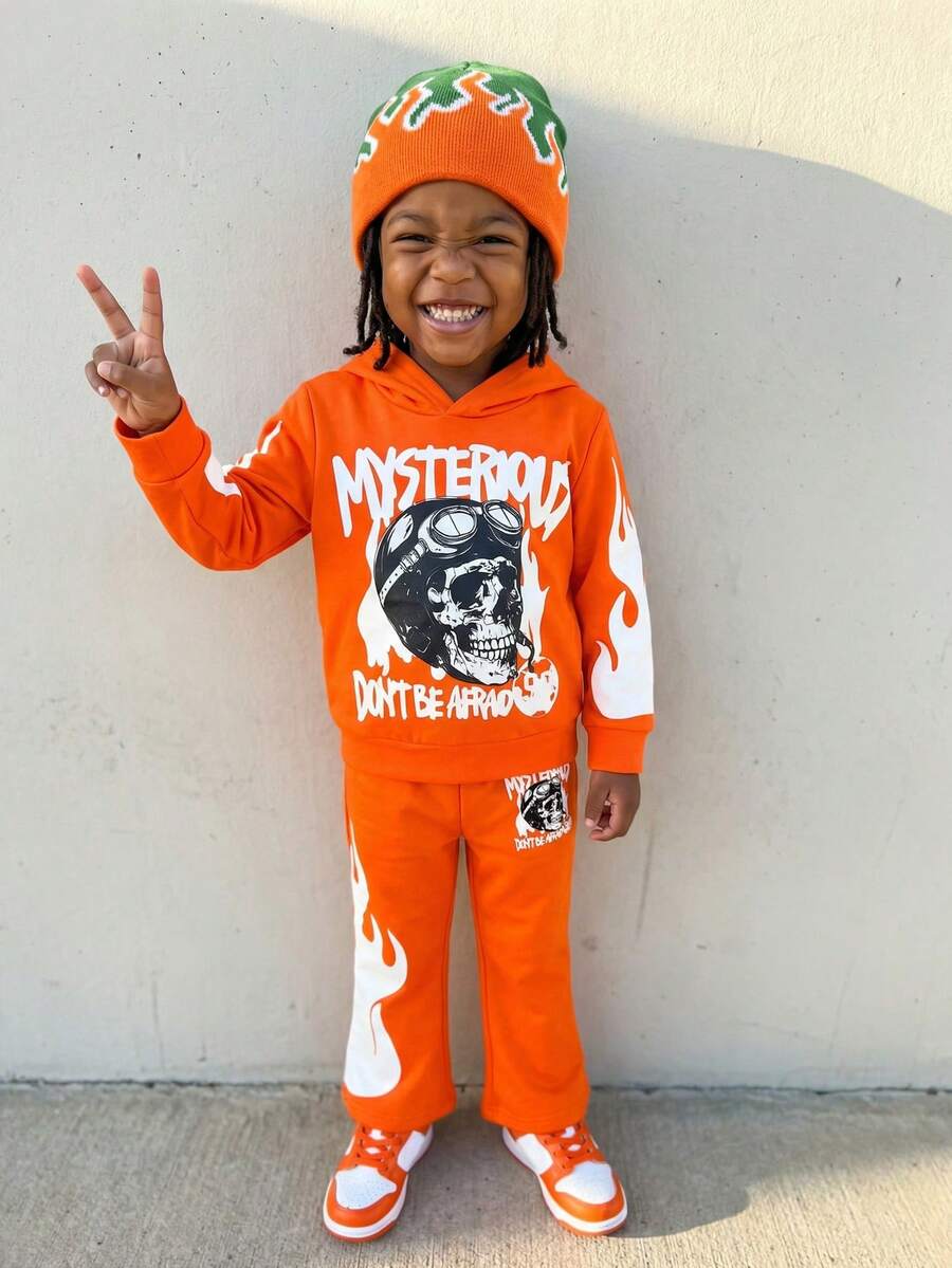 2 pièces/Set Jeune garçon sweat-shirt à capuche décontracté et léger avec imprimé lettre et crâne orange, Top à manches longues et pantalon long avec imprimé crâne noir, ensemble printemps/automne