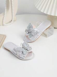 زوج من الصنادل المسطحة للأطفال البنات مزينة بفيونكة من الغليتر الفضي، تصميم سهل الارتداء، برأس مستدير، وبنعل مانع للانزلاق، صنادل شاطئ جميلة مناسبة للأعمار من 3 إلى 15 سنة، للاستخدام اليومي، العطلات، الحفلات، الربيع/الصيف - فضي - مشاهدة 6