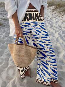 波西米亚风女式休闲时尚沙滩度假字母和海洋生物沙丁鱼印花宽松长裤，适合早午餐穿着，春夏款 - 黑色 - 查看 1