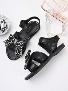 Sandalias de princesa para niñas, nuevas para el verano 2025, con lazo negro, con strass y perlas, de punta abierta, con cierre de gancho y bucle, y suela blanda - Negro - Ver 5