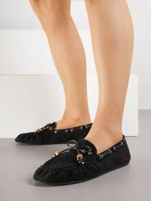 Mocassini con cuciture decorative, perline e fiocco - nero - Visualizzare 1
