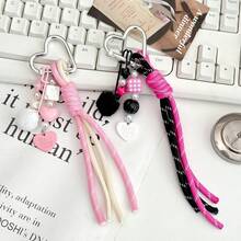 Questo portachiavi a forma di cuore è realizzato in corda intrecciata resistente con un design personalizzato. È un accessorio multifunzionale che può essere appeso a borse e bagagli per aggiungere un tocco di moda e può anche essere un ottimo piccolo regalo per uso quotidiano. - Multicolore - Visualizzare 1